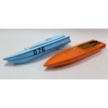 Two Galaxy large scale model boats, 48” long, & a pair of skis.