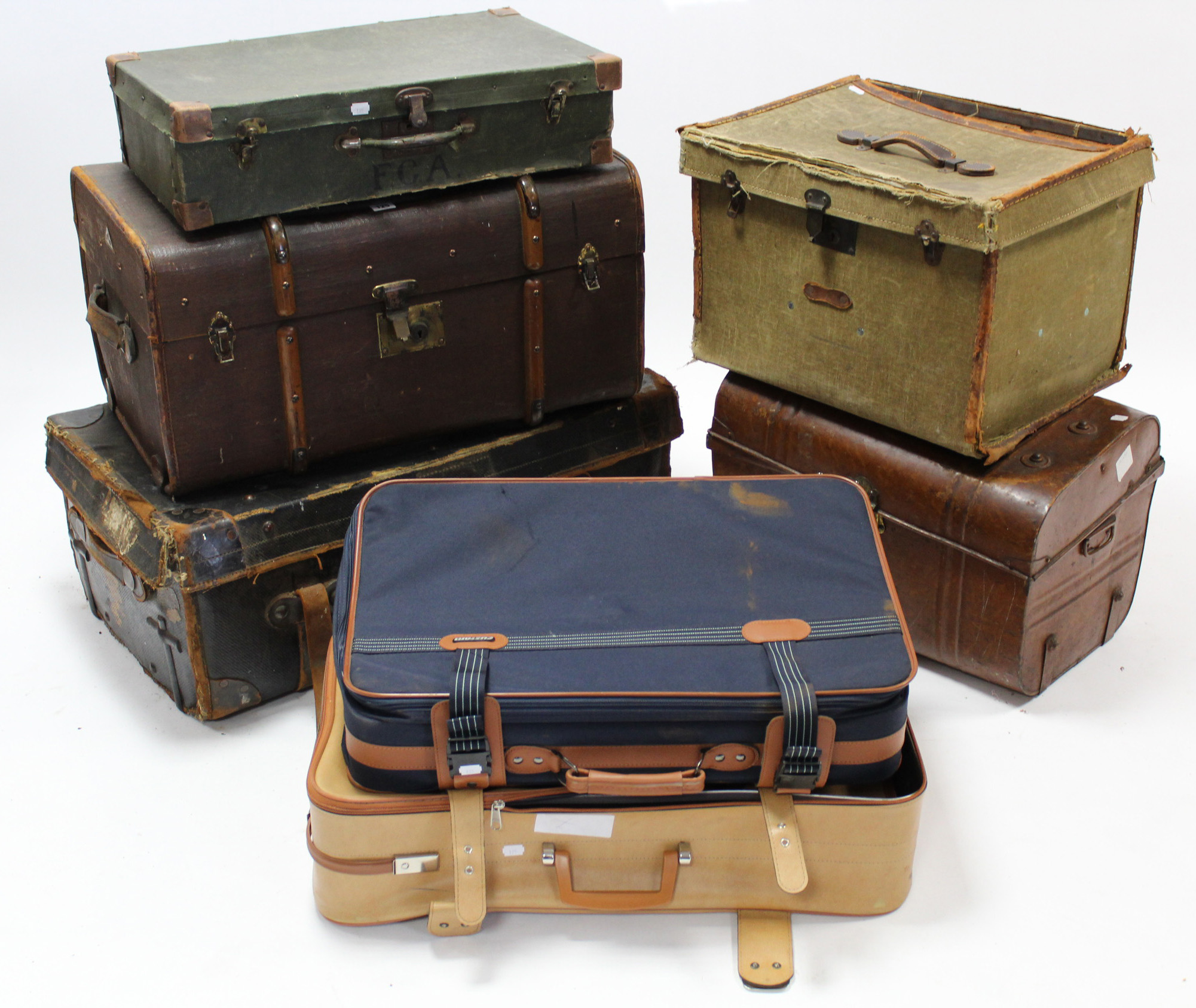 Seven various travelling trunks & suitcases.