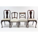 A pair of Queen Anne-style mahogany dining chairs with shaped splat backs, padded drop-in seats, &