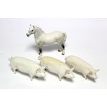 A Beswick model of a dapple grey foal “Welsh M”, 6¼” high; & three Beswick model pigs, part w.a.f.