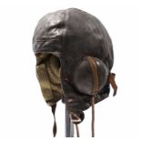 A WWII Wareings of Northampton brown leather pilot’s helmet, complete with wiring & earphones (No.