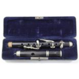 An ebony piccolo with plated fittings, 12½” long, with case.