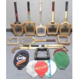 Five various wooden tennis racquets; a wooden squash racquet, each with press; & two wooden hockey