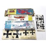 Three model kit aeroplanes, un-assembled, boxed.