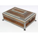 A 19th century Anglo-Indian sandalwood & ivory needlework box with hinged lid, profusely carved with