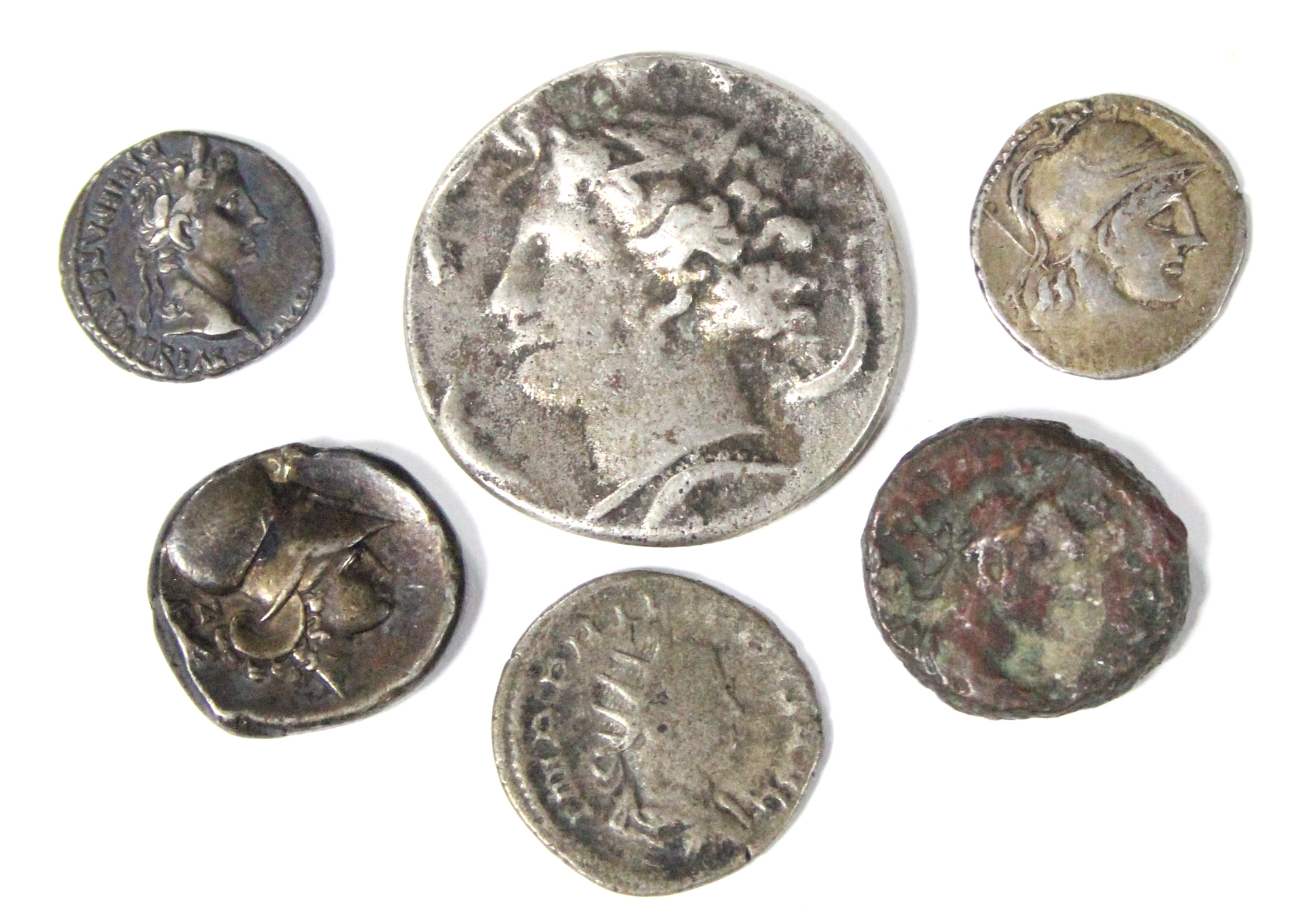 A Greek silver stater with Pegasus & head of Athena; a similar coin; & four Roman coins.