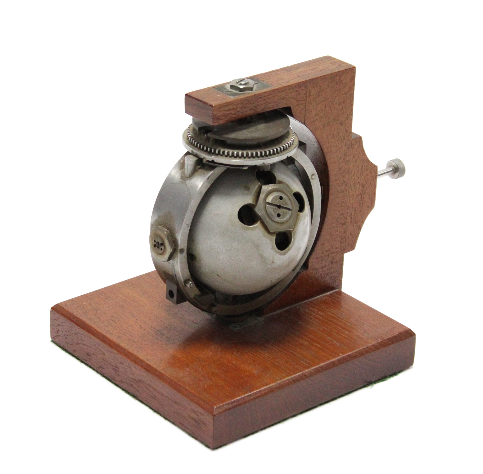 A torpedo gyroscope mounted on a wooden stand, 6¾” high.