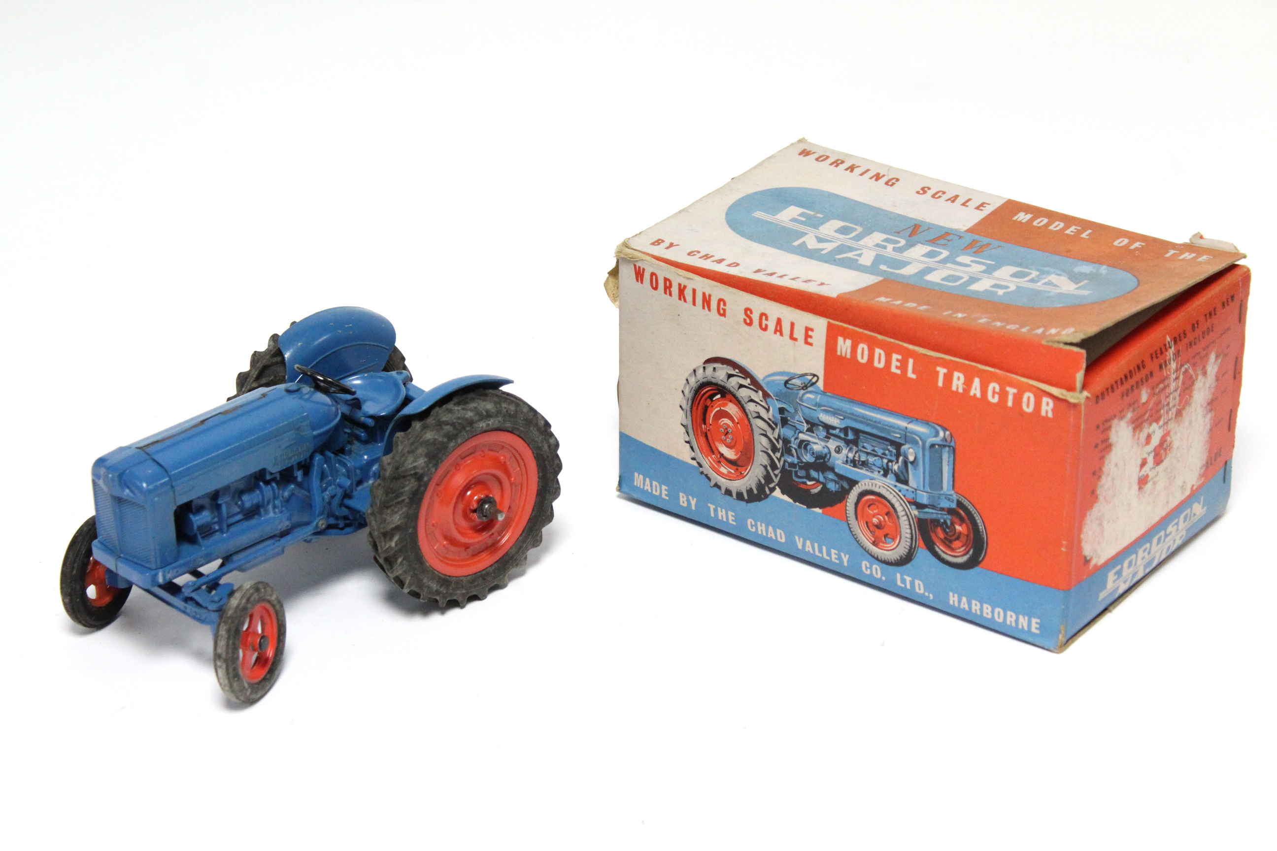 A mid-20th century Chad Valley clockwork-operated model of a Fordson Major Tractor, boxed.