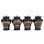 A set of four early 20th century Royal Doulton blue glazed stoneware “BEWLAYS” tobacco jars, 8½”