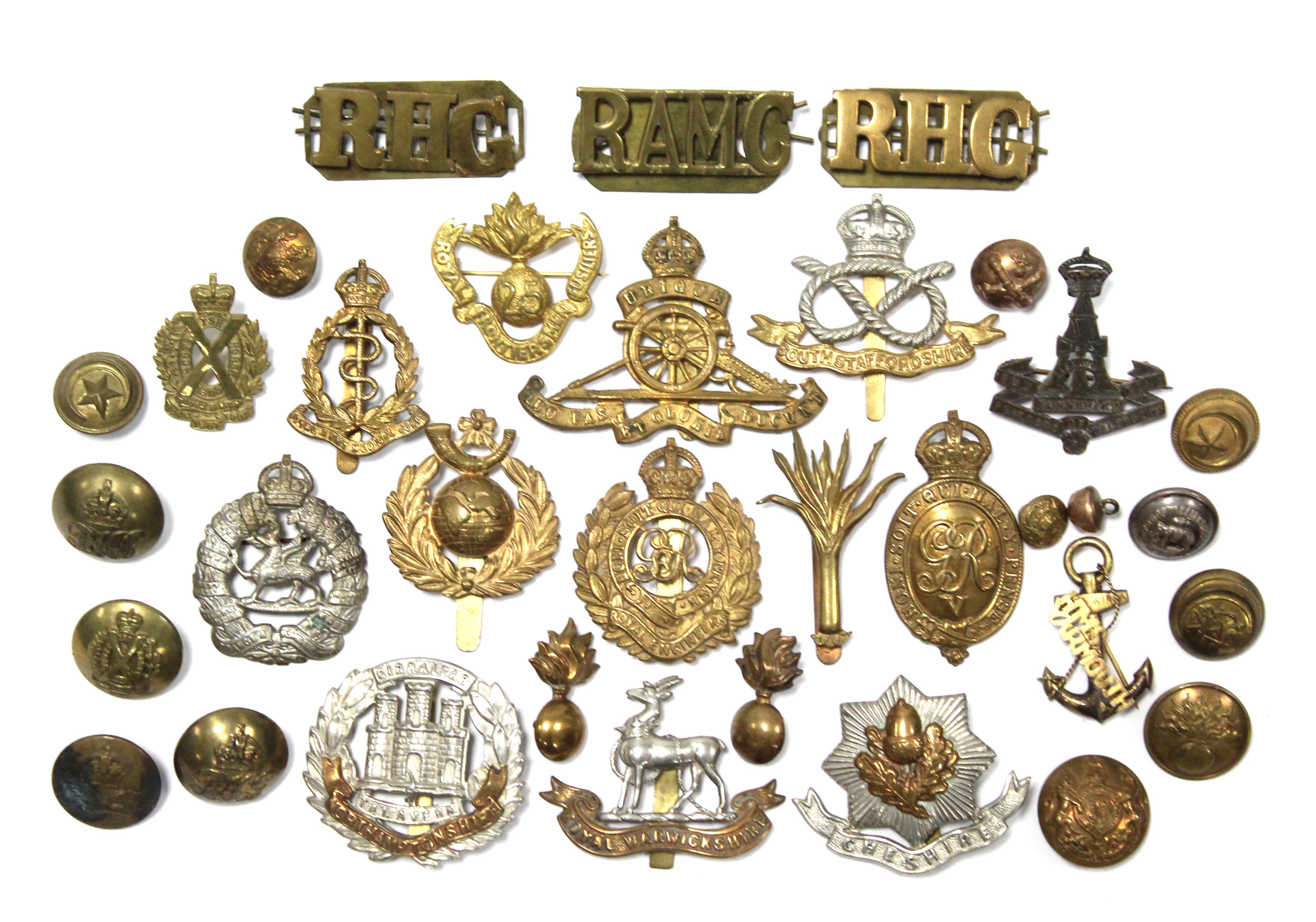 A collection of British military cap badges & tunic buttons.