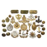 A collection of British military cap badges & tunic buttons.