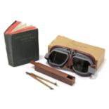 A pair of WWII aircraft pilot's goggles (MK VIII), boxed; together with a WWII drawing compass in