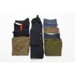 Nine various pairs of British military trousers.