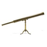 A late 19th/early 20th century French (?) brass library telescope with tripod, 40½” long.