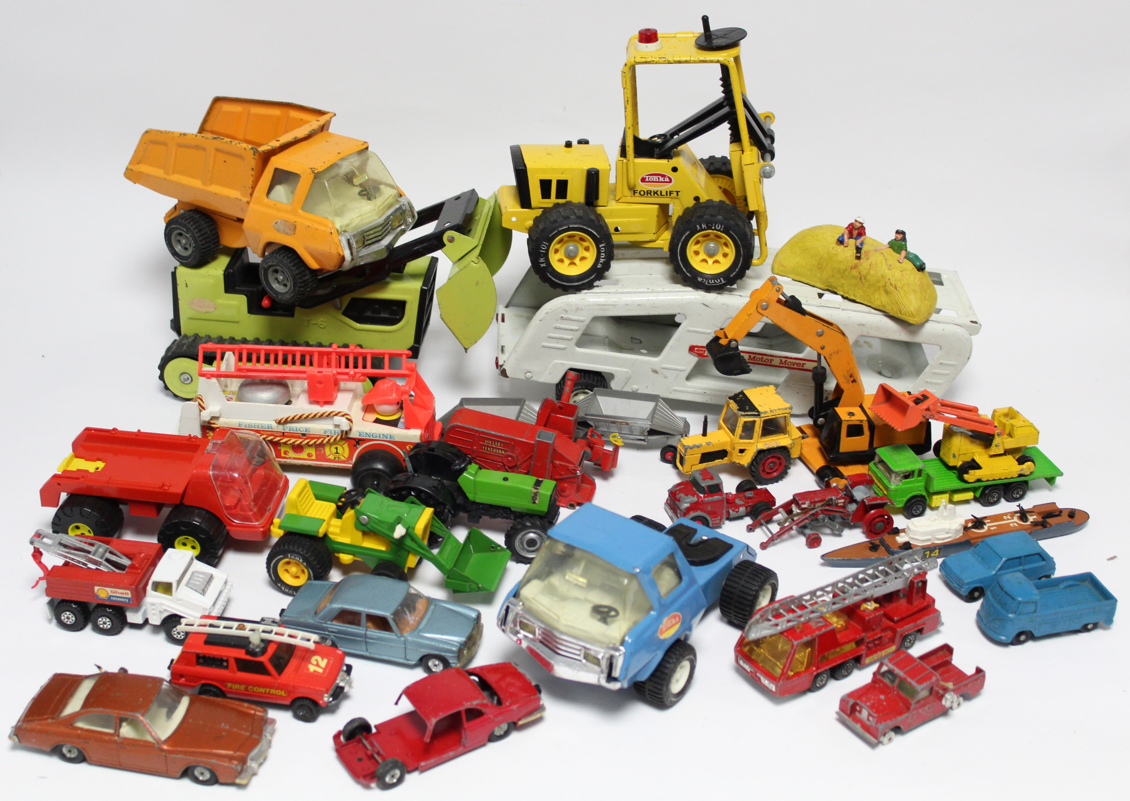 Approximately thirty various scale models by Corgi, Matchbox, Tonka, etc., all un-boxed.