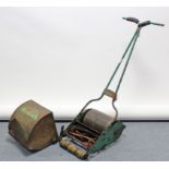 A vintage Webb push-along lawn mower with grass box.