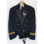 An R. A. F. pilot’s dress jacket, fitted with three miniature medals; a ditto pair of trousers; an