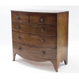 An early 19th century mahogany bow-front chest, fitted two short & three long graduated drawers with