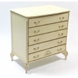 A cream & gilt finish bow-front chest fitted five long drawers, & on short cabriole legs, 31” wide x