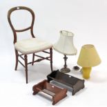 A balloon-back occasional chair; two book troughs; & two table lamps.