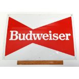 A Budweiser enamelled advertising sign.