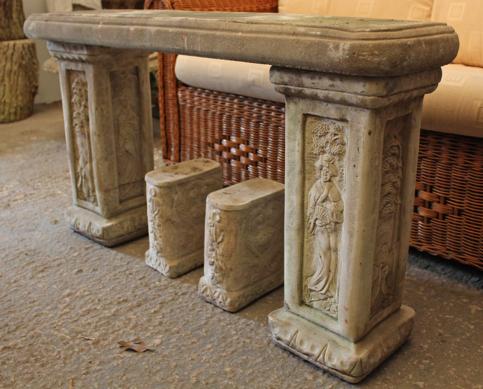 A pair of reconstituted stone garden seats, 43” long.