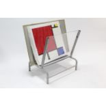 A light grey finish metal artist’s picture rack, 30¼” wide, with numerous dividers; & a coloured