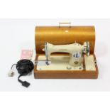 A Union electric sewing machine with carrying case, w.o.