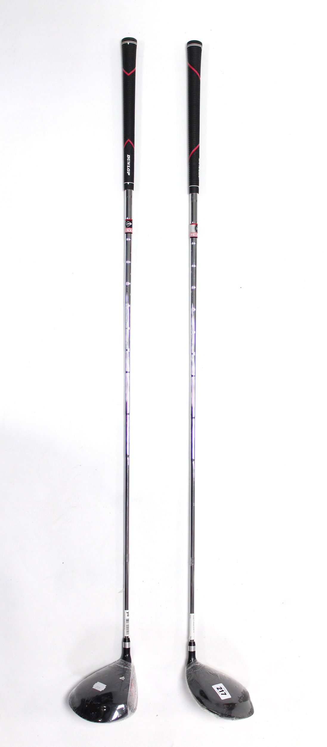 Two Dunlop steel-shafted golf clubs.