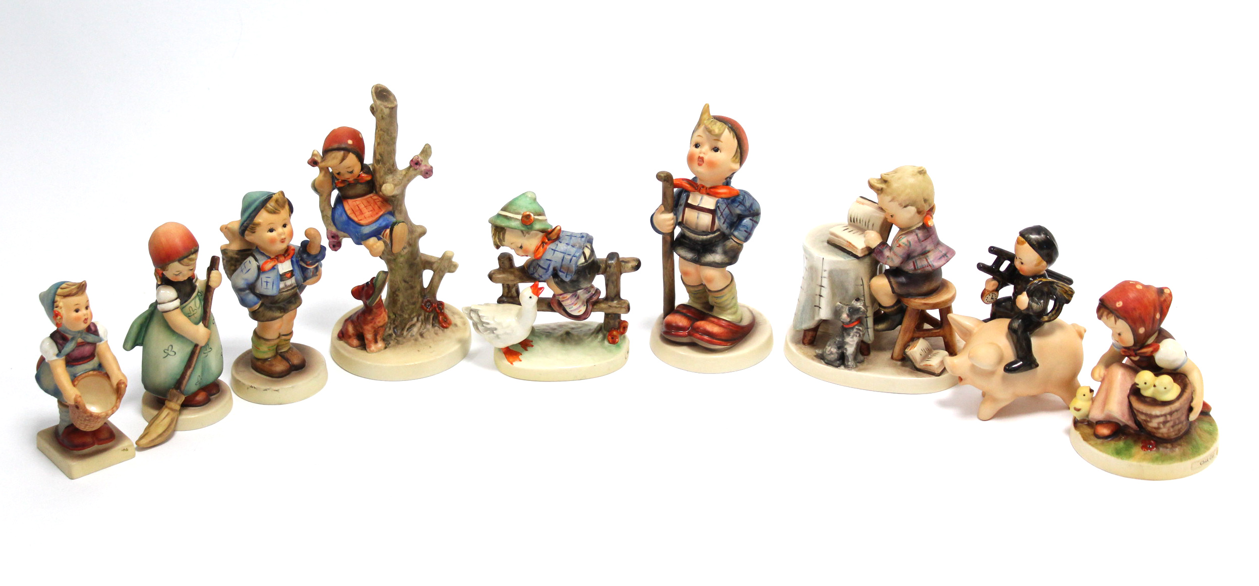 Four Goebel Hummel figures titled: “Little Sweeper”, “Chick Girl”, “Barnyard hero” & “Home From