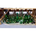 A large collection of green tinted glassware.
