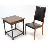 A Danish teak dining chair with padded seat & back upholstered black vinyl, & on square tapered