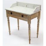 A pine marble-top washstand fitted frieze drawer, & on turned tapered legs, 30” wide.