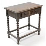 A 1930’s oak side table fitted frieze drawer, & on bobbin-turned legs & turned feet with plain