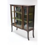 An Edwardian inlaid mahogany break-front china display cabinet, fitted two shelves enclosed by