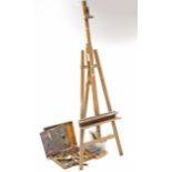 A wooden Gloucester fold-away studio easel, & various artists’ paints, brushes, etc.