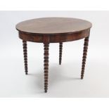 A Victorian mahogany oval centre table on four bobbin-turned tapered legs, 40½” wide.