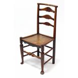 A late 19th century ladder-back cottage dining chair with hard seat, & on turned legs with spindle