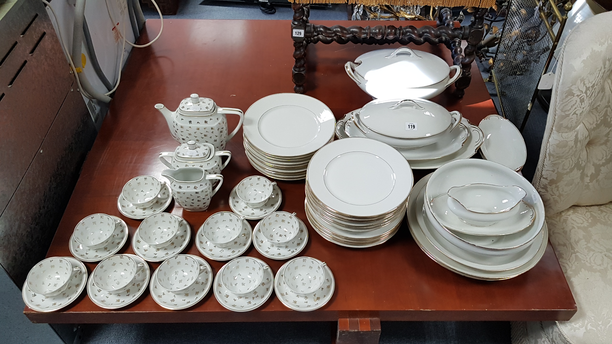 A Limoges thirty-three piece part dinner service of white ground & with gilt rims; & a Limoges