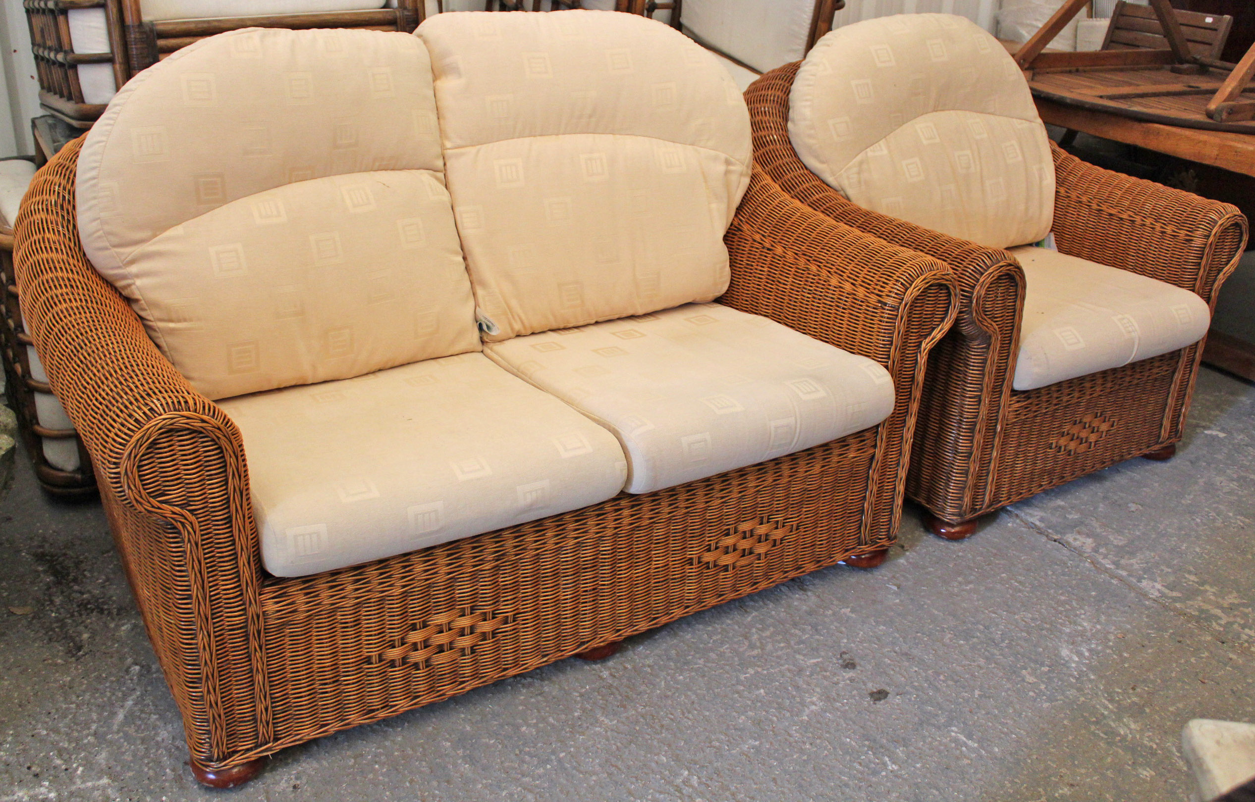 A Haddon House rattan two-seater conservatory settee with loose cushions to the seat & back, 60”