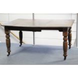 A late Victorian mahogany extending dining table with moulded edge & canted corners to the