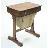 An early Victorian rosewood work table with rectangular top, fitted frieze drawer with pull-out work