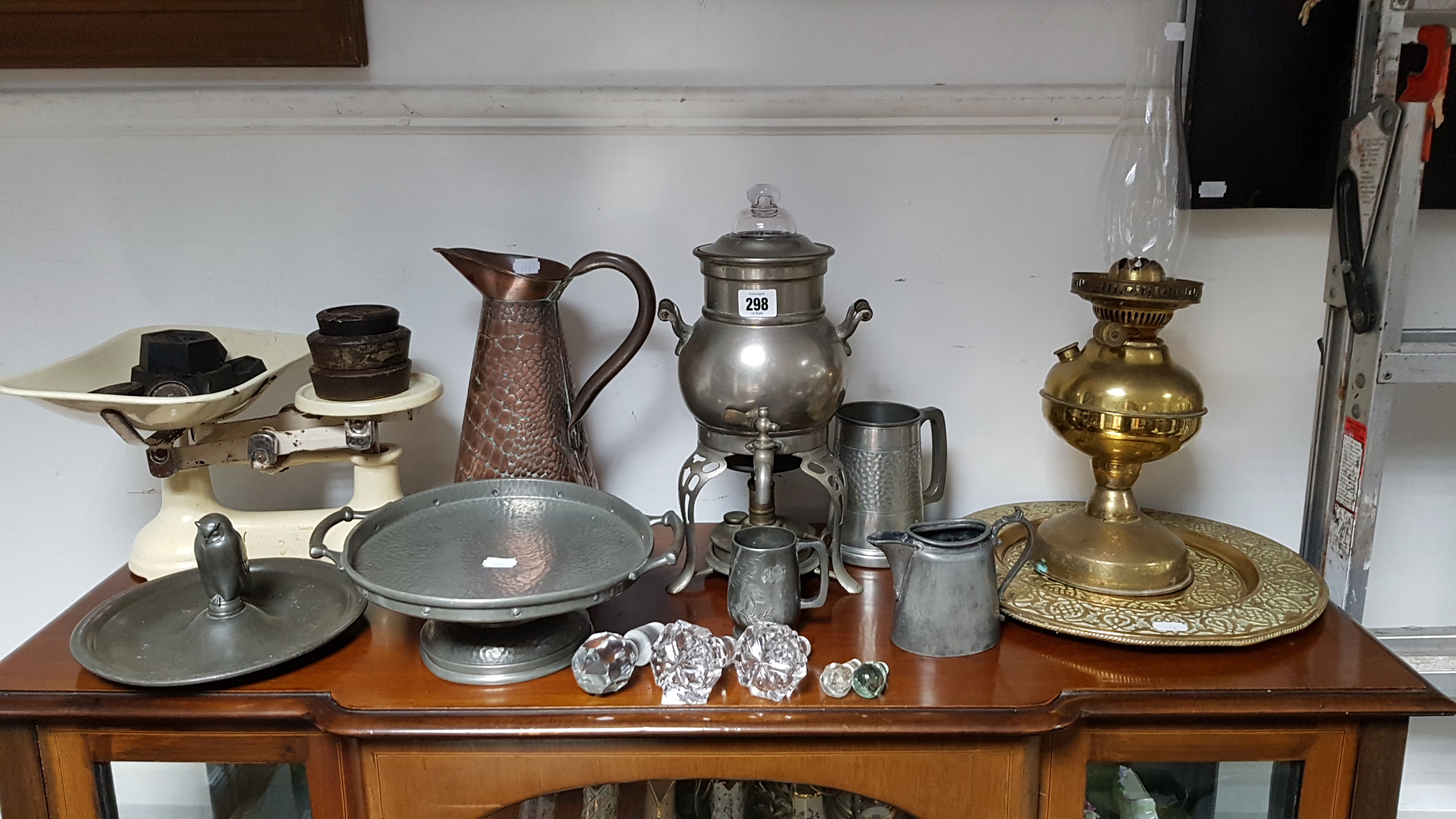 A pewter comport; a brass oil table lamp; asset of kitchen scales with weights; & sundry other