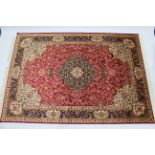 A Keshan small carpet of crimson & ivory ground, & with multi-coloured floral design to centre