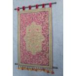 A silk embroidered wall hanging with all-over repeating scroll design, 53” x 32”; together with