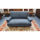 A two-seater settee upholstered blue material, & on short turned legs, 58” wide.