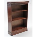 A reproduction mahogany standing open bookcase with four adjustable shelves, & on plinth base, 32”