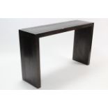 A hardwood side table with rectangular top & on square supports, 55” wide x 33 ½” high & on ditto