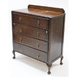 A mid-20th century oak chest fitted four long graduated drawers, & on short cabriole legs & pad