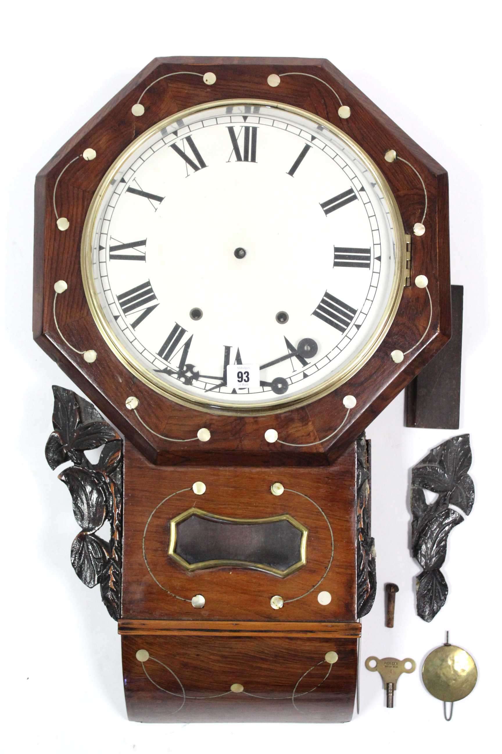 A Victorian drop-dial wall clock with black roman numerals to the white enamel dial, & in mother-